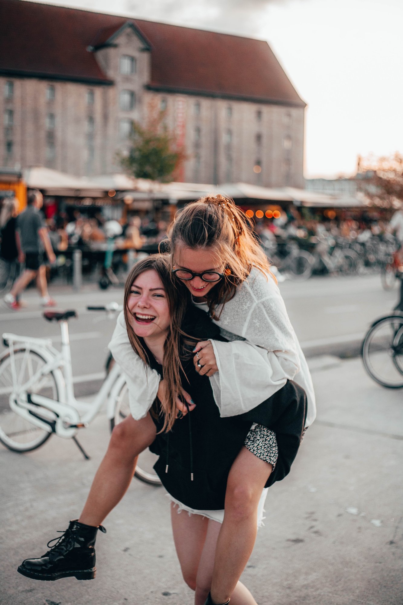 A student giving a piggy back to another student 